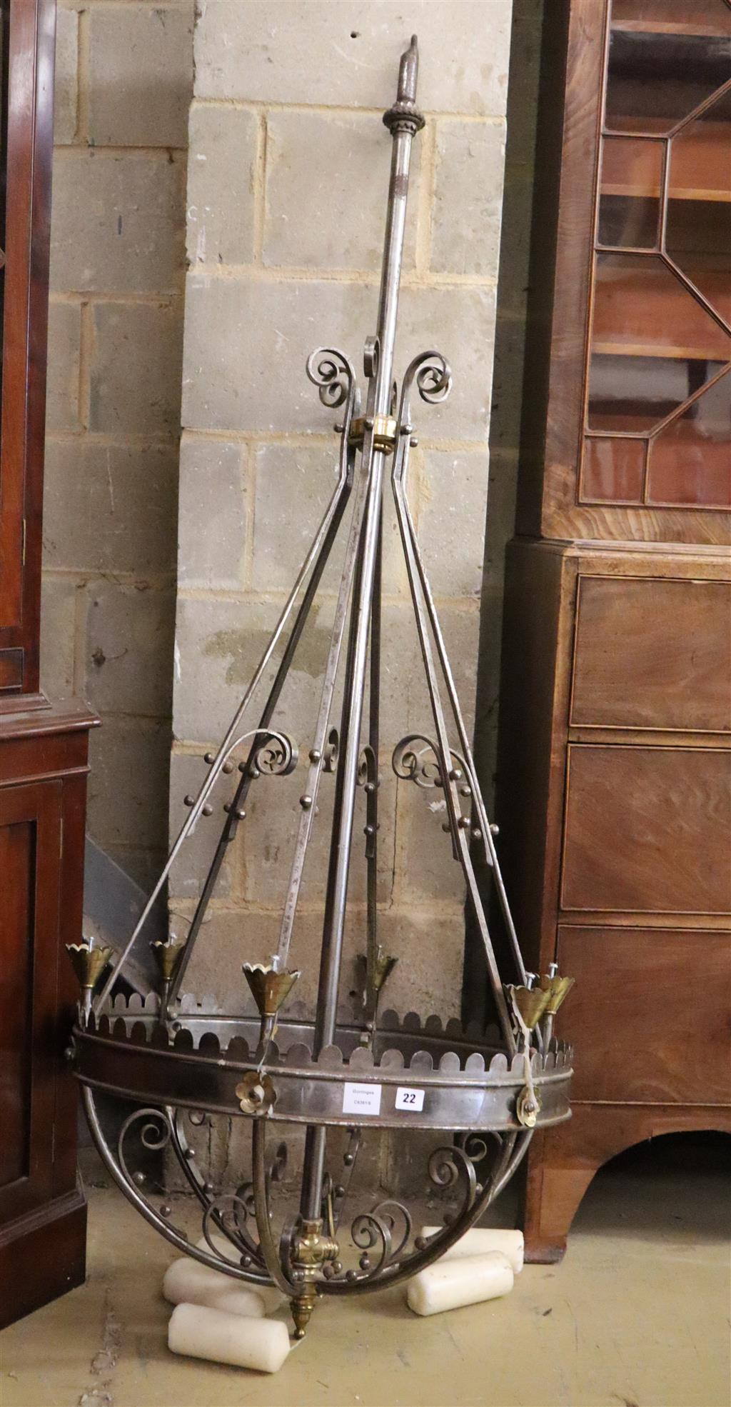 A Victorian steel and brass Gothic style chandelier, with conical brass sconces, drop 174cm, diameter 69cm